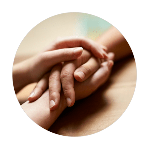 Two hands gently clasped in comfort, symbolizing compassionate end-of-life doula care, emotional support, and presence.